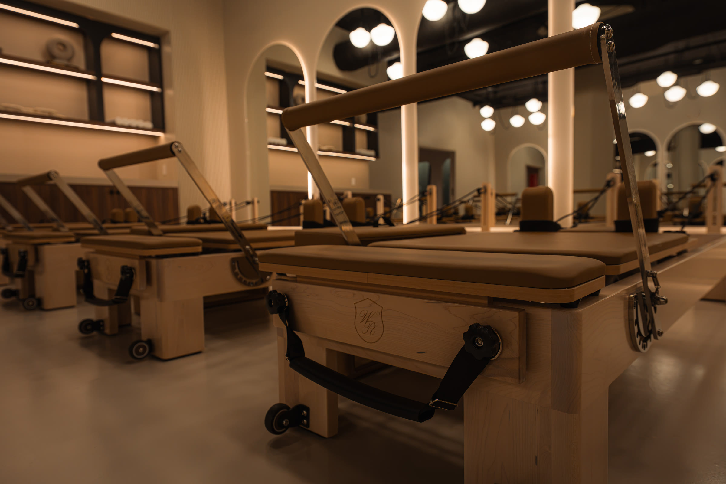 Sunlit reformer Pilates studio interior at Wellness Republic